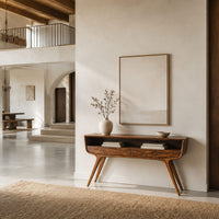 Curved console table with two drawers, open shelf and tapered legs in a bright open plan entryway