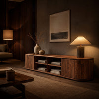 Long tv stand with curved ends, solid end panels and four open center cubbies in an evening living room with walnut wall paneling