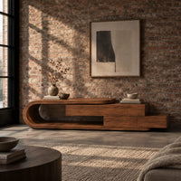 Low tv stand with a looped end and stepped wooden boxes in an industrial loft living room with exposed brick