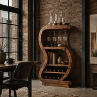 S shaped open bar cabinet with a glass rail and tiered bottle shelves in an industrial loft dining room with exposed brick