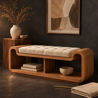 Corner detail of curved bench with a tufted seat cushion and two open cubbies below beside wood, brass and linen samples
