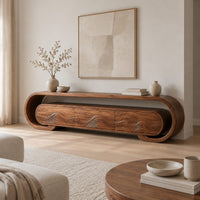 Low tv stand with a looped frame and three wave carved fronts in a Scandinavian living room with white walls