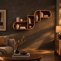 Stepped s shaped wall shelf with open cubbies of different sizes in a dark living room at golden hour
