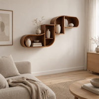 Stepped s shaped wall shelf with open cubbies of different sizes in a Scandinavian living room with white walls