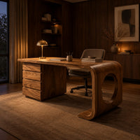 Desk with a drawer pedestal and a curved leg with a round cutout in an evening home office with walnut wall paneling
