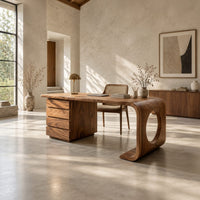 Desk with a drawer pedestal and a curved leg with a round cutout in a bright open plan home office