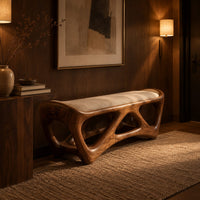Cushioned bench with an open lattice wood base in an evening entryway with walnut wall paneling