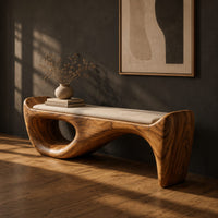 Cushioned bench with a sweeping sculpted body and an oval cutout, three-quarter view showing the grain