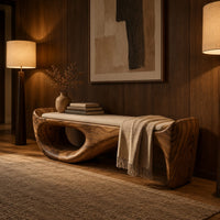 Cushioned bench with a sweeping sculpted body and an oval cutout in an evening entryway with walnut wall paneling