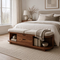 Low bench with two seat cushions, two center drawers and open end shelves in a Scandinavian bedroom with white walls