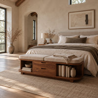 Low bench with two seat cushions, two center drawers and open end shelves in a bright open plan bedroom