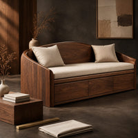 Corner detail of daybed style sofa with an arched back and a three panel wood front beside wood, brass and linen samples