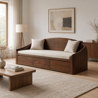 Daybed style sofa with an arched back and a three panel wood front in a Scandinavian living room with white walls