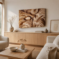 Deep carved wooden wall relief with an oval eye and flowing swirls above a light oak sideboard in daylight