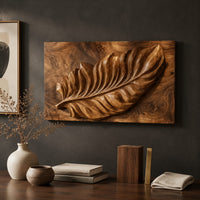 Detail of rectangle wooden wall panel with a deep relief leaf carved across swirling grain beside wood, brass and linen samples