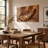 Rectangle wooden wall panel with a deep relief leaf carved across swirling grain beside a dining table in natural light