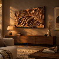 Wide carved wood relief panel of a sweeping feather with flowing layered barbs above a low console in an evening living room