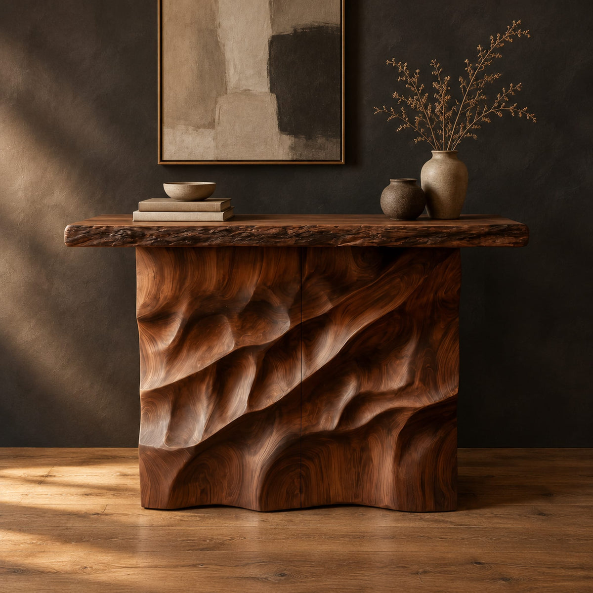 Console table with deep diagonal ripple carving on a solid base in a dark studio against a charcoal plaster wall