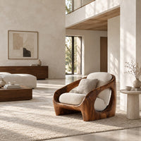 Thick shell wooden chair with wide side openings and cream cushions in a bright open plan living room