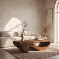 Dark coffee table with a deep U shaped open shelf in an open plan space in daylight