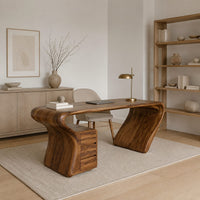 Desk with a top that flows into a slanted leg and drawer pedestal in a Scandinavian home office with white walls