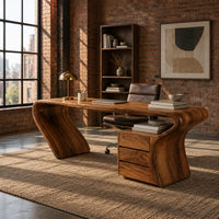 Desk with a top that flows into a slanted leg and drawer pedestal in an industrial loft home office with exposed brick