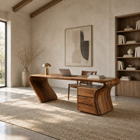 Desk with a top that flows into a slanted leg and drawer pedestal in a bright open plan home office