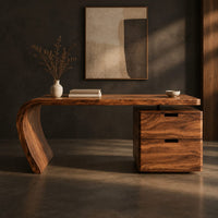 Corner detail of desk with a single swept side leg and a two drawer cabinet beside wood, brass and linen samples