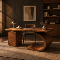 Desk with a sweeping scroll base and a three drawer pedestal in a dark home office at golden hour