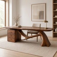 Wooden desk with a swooping single leg and a stacked drawer block in a Scandinavian home office with white walls