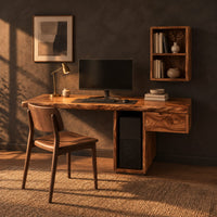 Wooden desk with a thick slab top and a hollow column support in a dark home office at golden hour