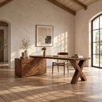 Wooden desk with a wave carved cabinet block and an x shaped leg in a bright open plan home office
