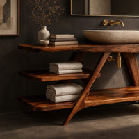 Corner detail of freestanding vanity with a diagonal brace and two open tiered shelves beside wood, brass and linen samples