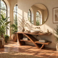 Slab top stand on a diagonal sweeping support with an offset lower shelf in a bright bathroom with arched windows and plants