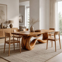 Rectangular dining table on a looping ribbon pedestal base in a Scandinavian dining room with white walls