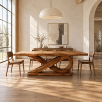 Rectangular dining table with a thick plank top on a sculpted loop base in a bright open plan dining room