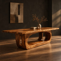 Rectangular dining table with a thick slab top on a hollowed oval base, three-quarter view showing the grain