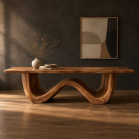 Dining table with a thick plank top on one sculpted wave base in a dark studio against a charcoal plaster wall