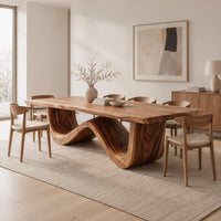 Dining table with a thick plank top on one sculpted wave base in a Scandinavian dining room with white walls