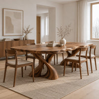 Dining table with two twisted pedestals and a live edge top in a Scandinavian dining room with white walls