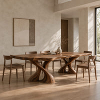 Dining table with two twisted pedestals and a live edge top in a bright open plan dining room