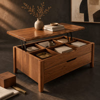 Corner detail of rectangular lift top coffee table with divided compartments and tapered legs beside wood, brass and linen samples