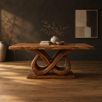Dining table with a wavy edged slab top and a double infinity loop base in a dark studio against a charcoal plaster wall