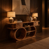 Console table with a double loop base and two small drawers in an evening entryway with walnut wall paneling