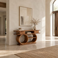 Console table with a double loop base and two small drawers in a bright open plan entryway