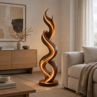 Twisting double ribbon floor lamp with a warm glow in a Scandinavian living room with white walls
