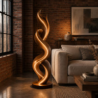 Twisting double ribbon floor lamp with a warm glow in an industrial loft living room with exposed brick
