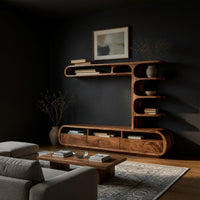 Drawer TV console with a column of curled shelves in a dark studio against a charcoal wall