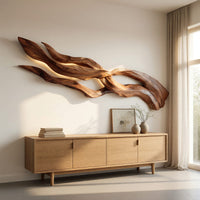 Streaming strands driftwood style wall sculpture above a light oak sideboard in daylight