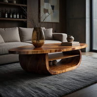 Oval coffee table on a drum base with an open shelf in a concrete and timber loft